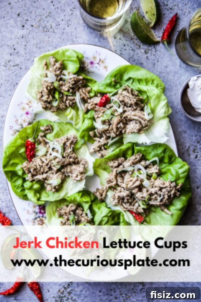 Crisp Jerk Chicken Lettuce Wraps 8 A close-up of vibrant Jerk Chicken Lettuce Cups, garnished and ready to eat