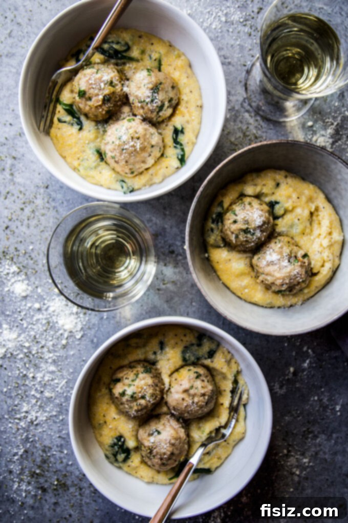 Creamy Polenta with Italian Wedding Chicken Meatballs 8 Garnished Italian wedding chicken meatballs with fresh herbs
