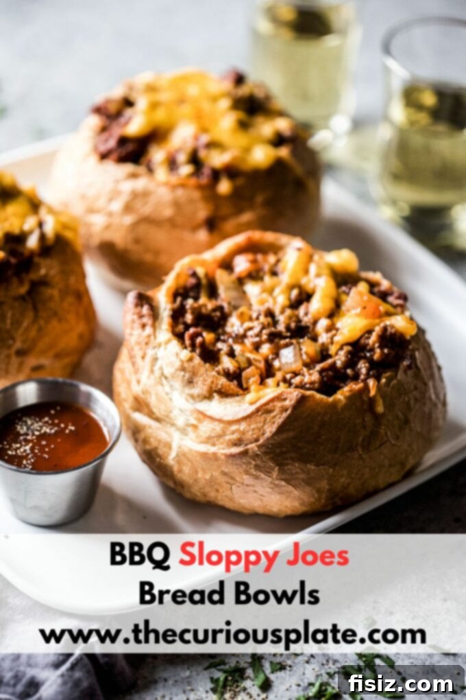 Loaded BBQ Sloppy Joe Bread Bowls 10 A top-down view of a BBQ sloppy joe bread bowl, beautifully garnished with fresh herbs and ready to enjoy