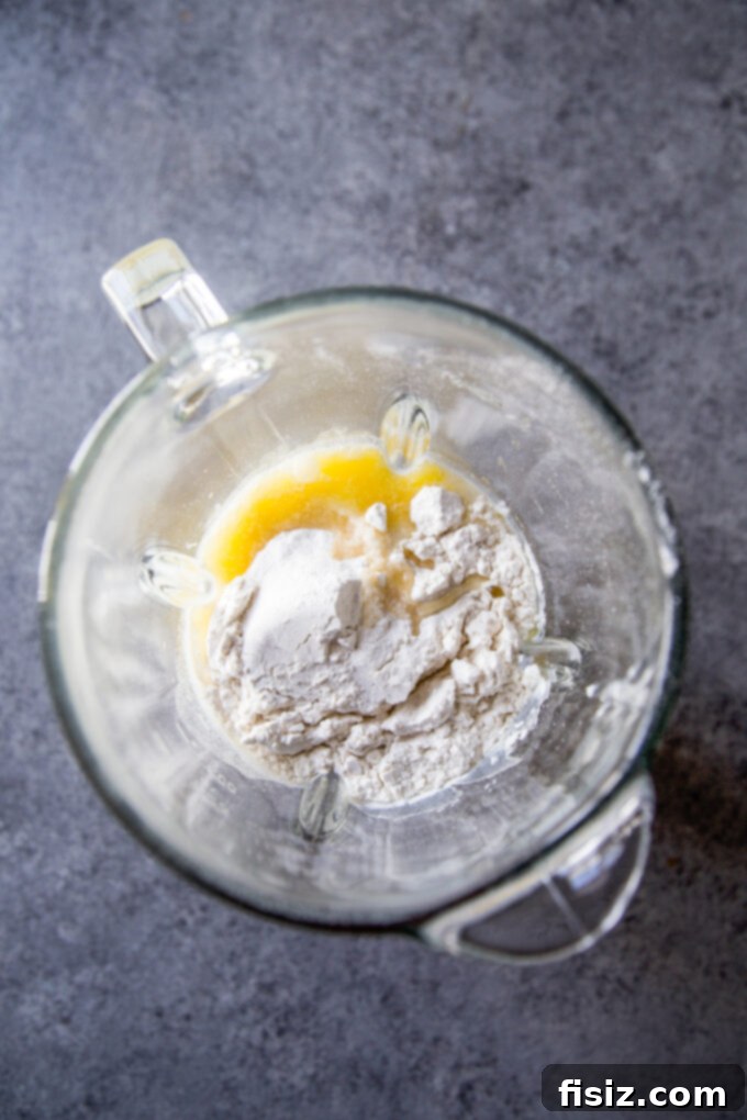 Herbed Protein Skillet Cakes 4 Pancake ingredients including cottage cheese, eggs, milk, and flour, ready to be blended.