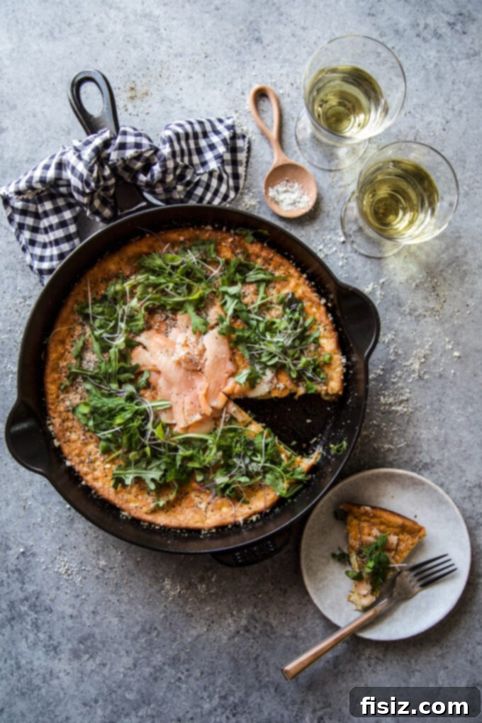 Herbed Protein Skillet Cakes 8 Final presentation of High Protein Herbed Skillet Pancake with generous toppings of smoked salmon, dill, arugula, and microgreens. www.thecuriousplate.com