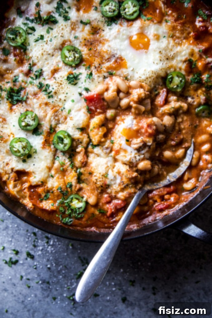 One-Pan Chorizo and White Bean Enchilada Bake 3 Close-up of the bubbling chorizo and white bean enchilada skillet before adding eggs.