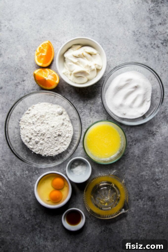 Velvety Citrus Ricotta Cake with a Bright Orange Drizzle 4 Assortment of fresh ingredients for Citrus Ricotta Cake including oranges, ricotta, flour, and butter