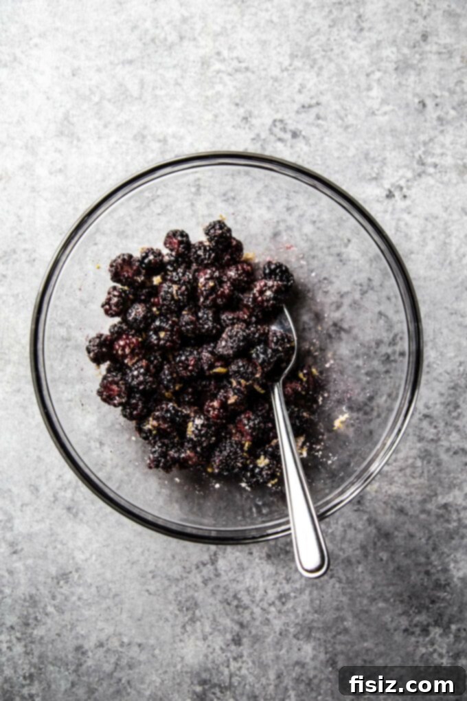 Spiced Blackberry Brie Delights 4 blackberries in a bowl with sugar