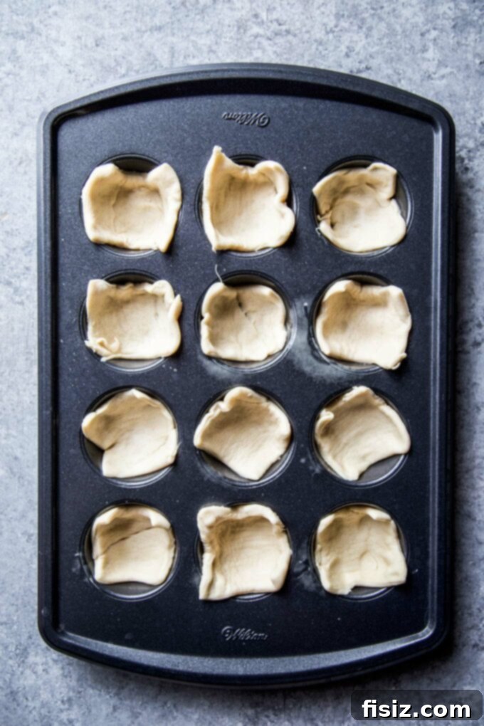 Spiced Blackberry Brie Delights 5 crescent dough in a muffin tin