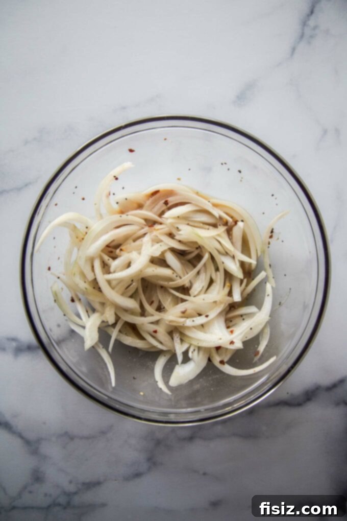Zesty Pickle Panzanella 5 Thinly sliced white onions tossed in the vibrant dressing