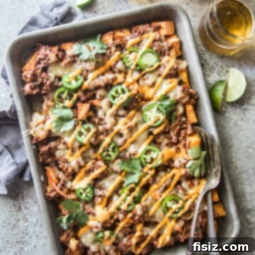Korean BBQ Nachos Supreme 9 Beef and Kimchi Sweet Potato Nachos with a blend of unique flavors.