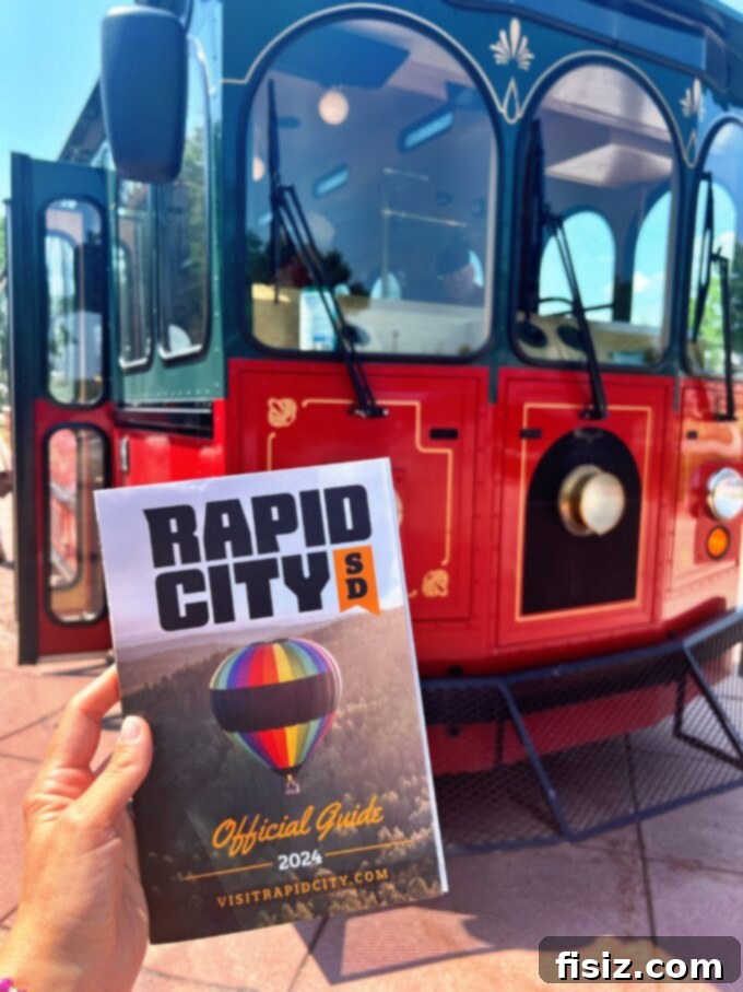 Rapid City South Dakota Stay Eat Explore 28 The classic City View Trolley driving through the streets of Rapid City, offering scenic tours.