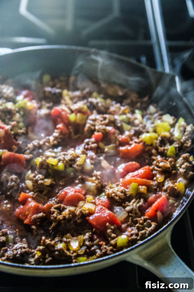 Fiery Beef Orzo 5 A large skillet filled with Chili Spiced Beef Orzo, after cooking and before garnishing