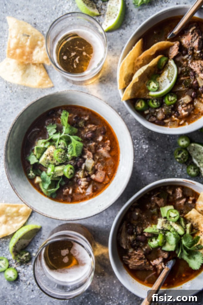 Tender Slow Cooker Tex-Mex Lamb Tortilla Soup 7 Close-up of Slow Cooker American Lamb Shoulder Tex-Mex Tortilla Soup with vibrant toppings
