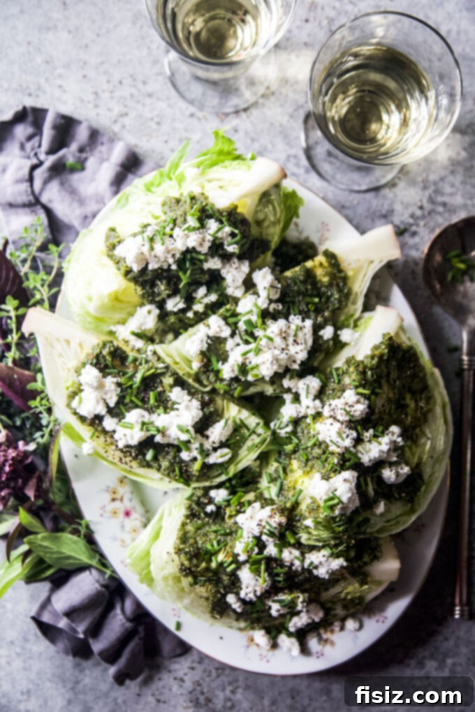 Zesty Tabouli Wedge 7 A vibrant close-up of the Easy Tabouli-Style Wedge Salad, showcasing the rich colors of the dressing, fresh herbs, and cheese.