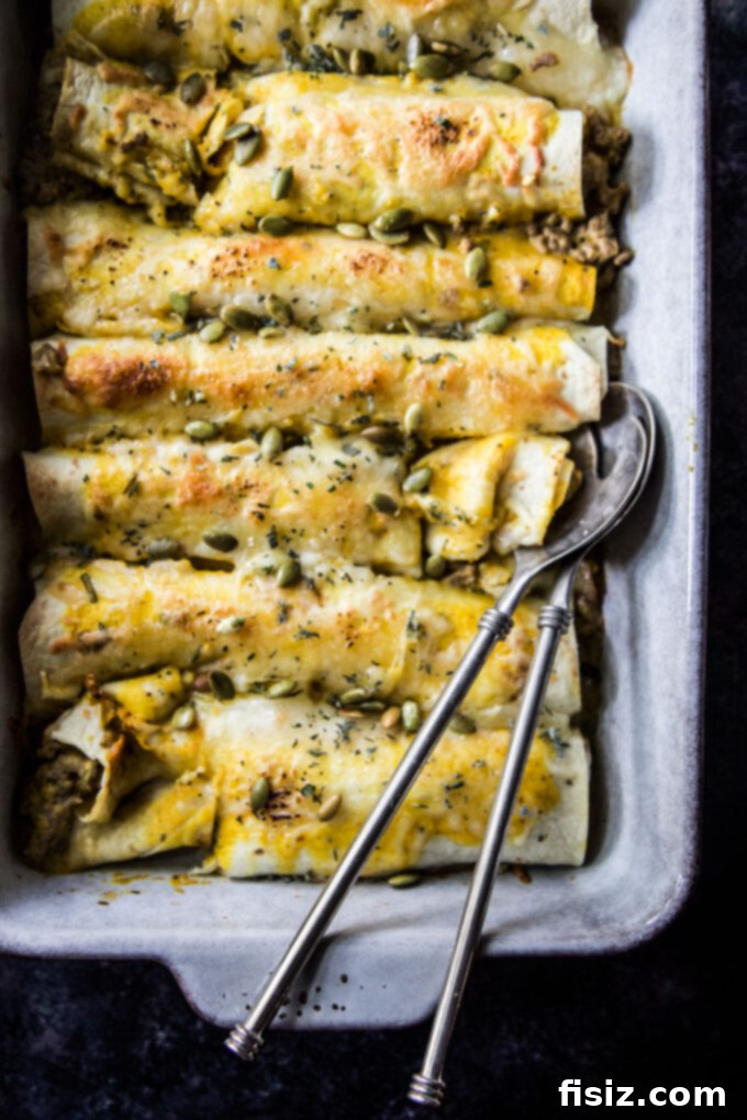 Smothered Beef and Pumpkin Enchiladas 4 cheesy beef & pumpkin enchiladas being prepared