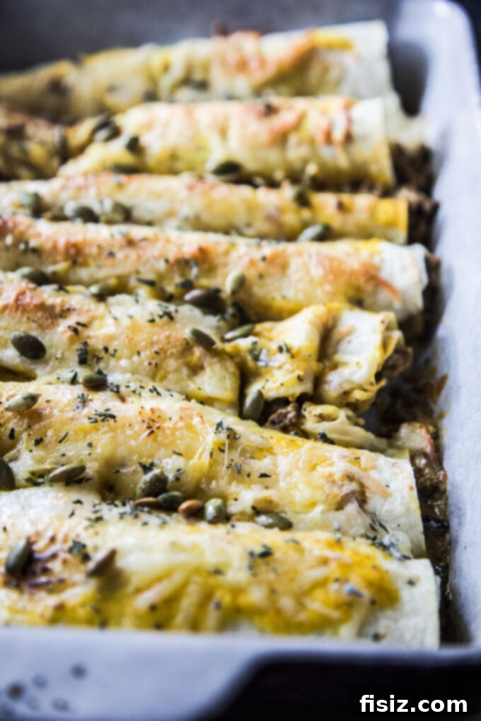 Smothered Beef and Pumpkin Enchiladas 9 cheesy beef & pumpkin enchiladas served with rice