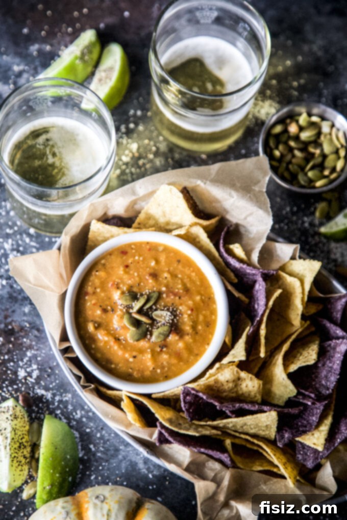 Tangy Heat Pumpkin Tomatillo Salsa 7 Spiced Pumpkin Tomatillo Salsa in a serving bowl, ready for dipping.