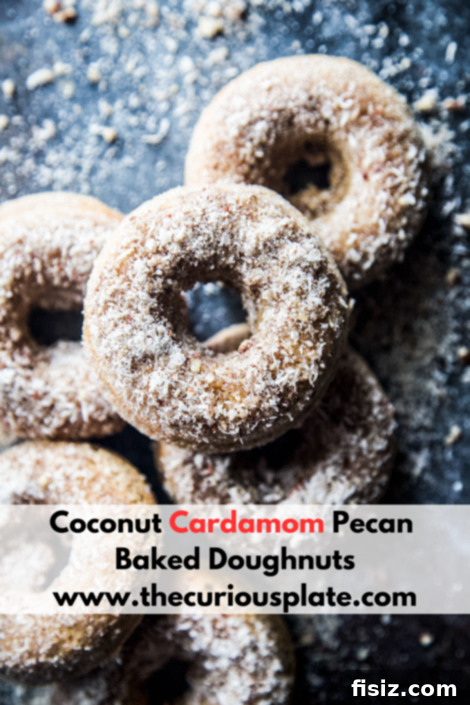 Heavenly Baked Coconut Cardamom Pecan Doughnuts 10 A final close-up of a single Coconut Cardamom Pecan Baked Doughnut, showcasing its tempting coating
