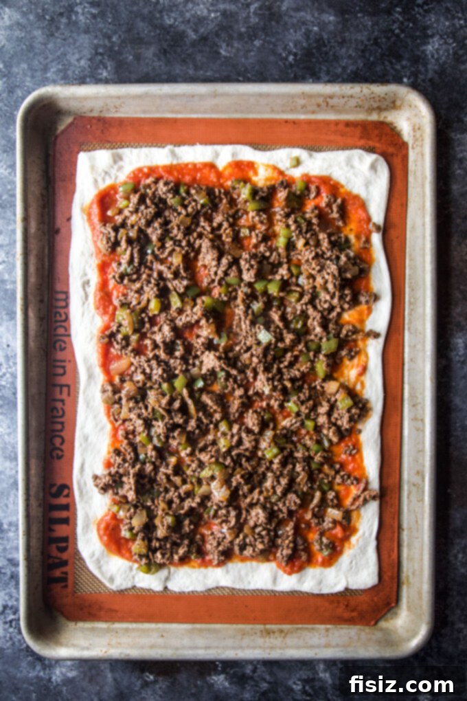 Loaded Chili Cheese Pizza 6 Chili cheese pizza with vibrant green bell peppers and melted cheese