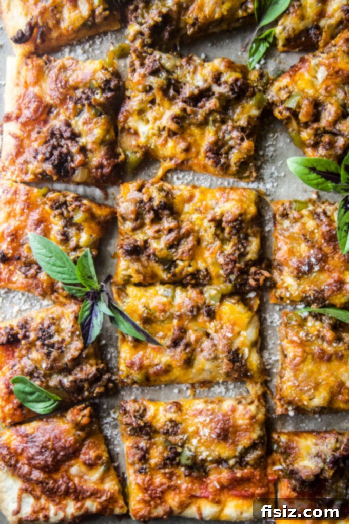 Loaded Chili Cheese Pizza 10 Easy Chili Cheese Pizza on a serving board with a slice removed