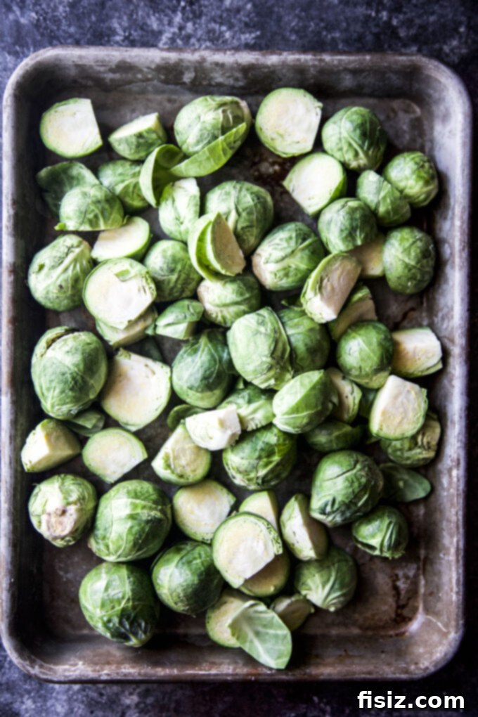 Crispy Brussels Sprouts with Lemon and Mint 4 brussels sprouts sliced in a pan