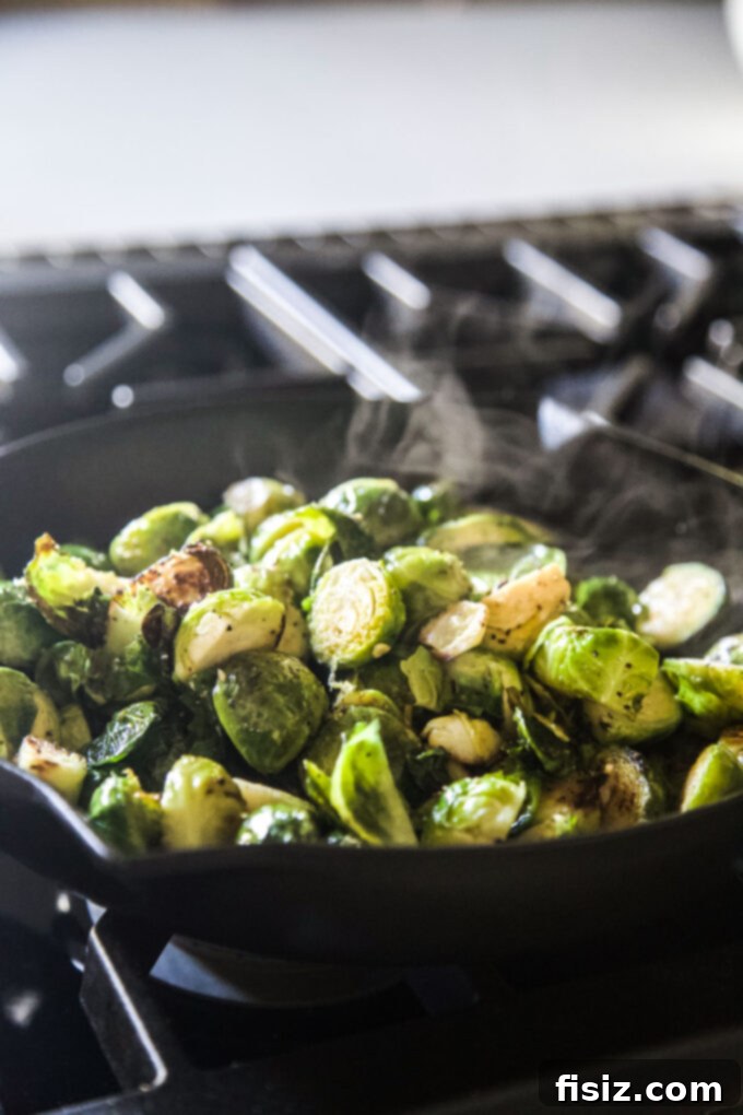 Crispy Brussels Sprouts with Lemon and Mint 5 brussels sprouts in a skillet