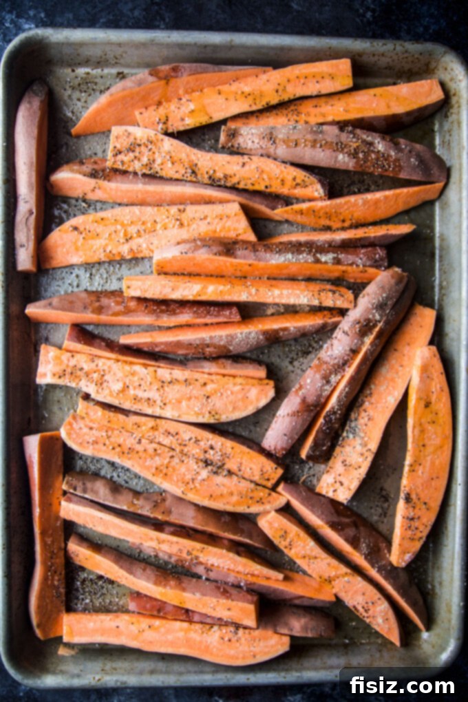 Ginger-Roasted Sweet Potatoes featuring Blue Cheese and Pickled Walnut Salsa 6 sweet potato wedges on a baking sheet