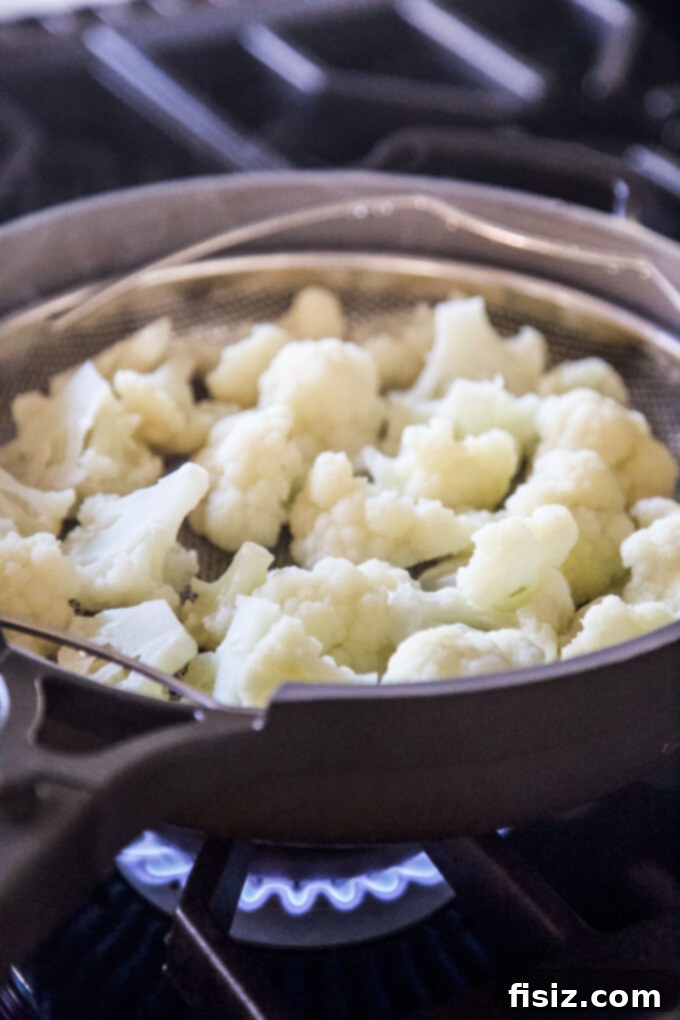 Garlic Bread Crusted Cheesy Cauliflower Bake 4 steamed cauliflower in a basket