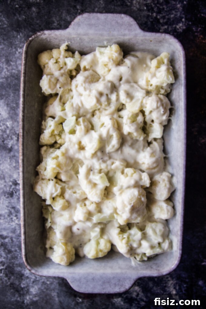 Garlic Bread Crusted Cheesy Cauliflower Bake 5 cauliflower covered with cheese sauce