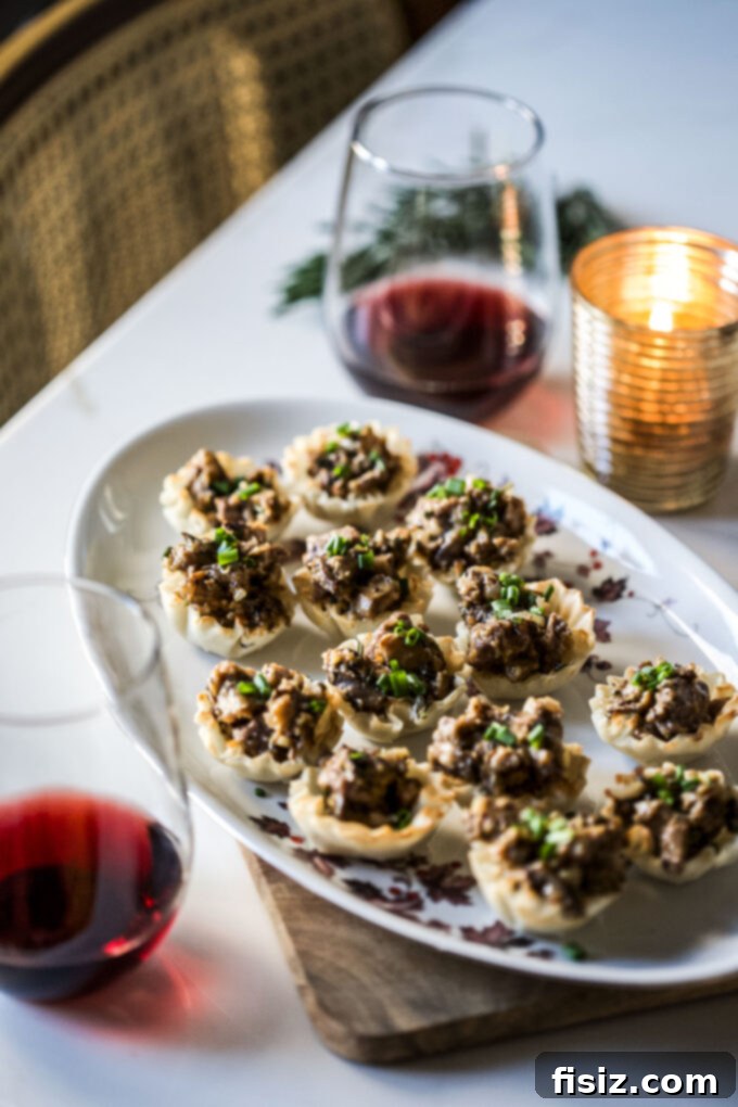 Individual Lamb Wellingtons 8 Mini Lamb Wellington Bites with fresh chive garnish