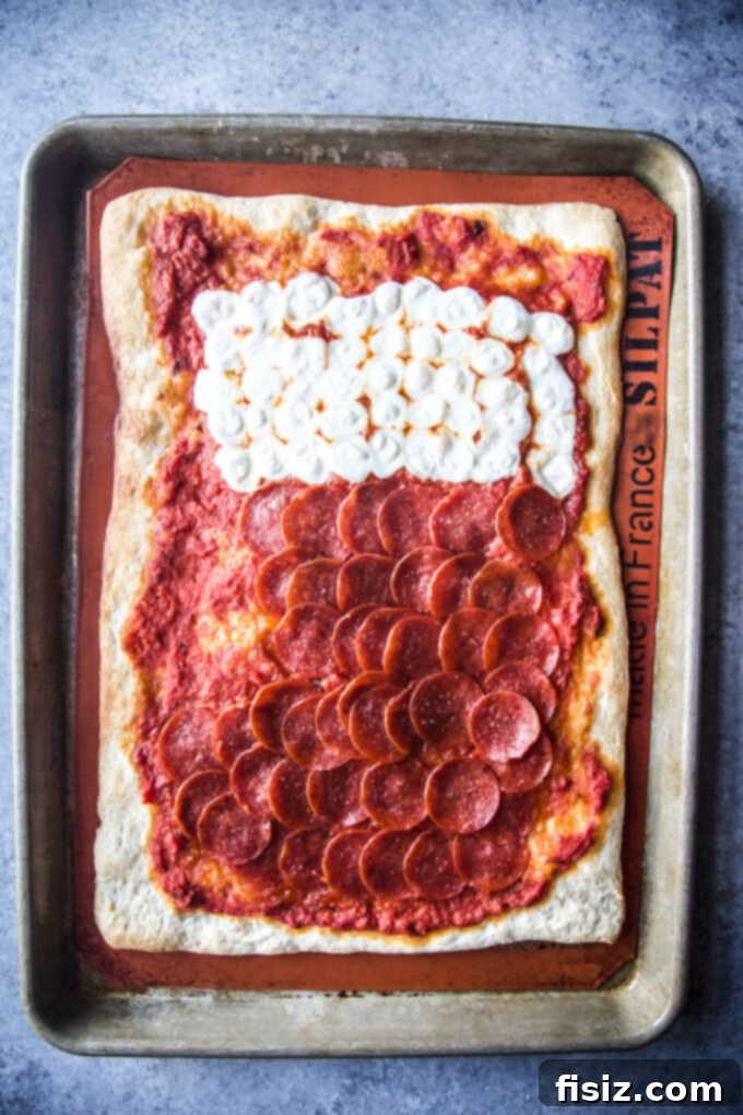 Cooked stocking shaped pizza, golden brown with melted cheese and crisp pepperoni