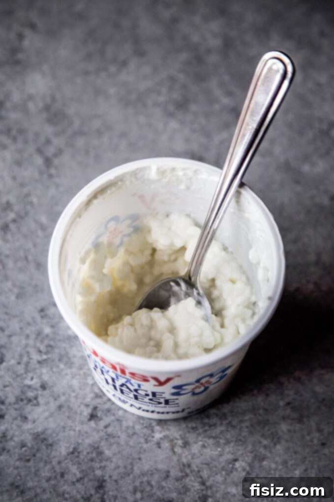cottage cheese in a container for high-protein greek baked ziti