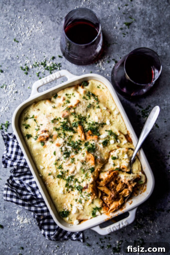 high-protein greek baked ziti, garnished with fresh parsley