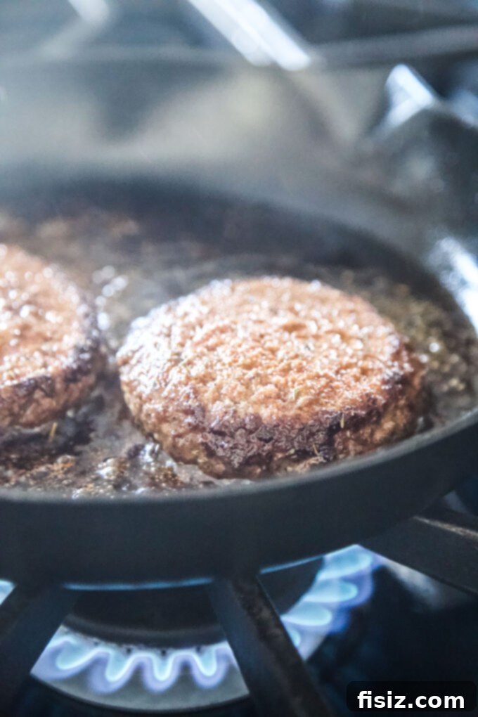 Creole Skillet Burger with Zesty Ranch Fries 6 Creole burgers sizzling in a hot cast iron skillet