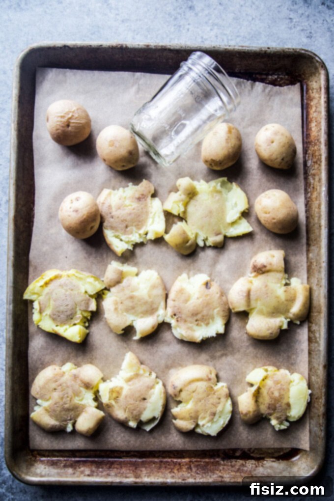 smashed potatoes on a baking sheet