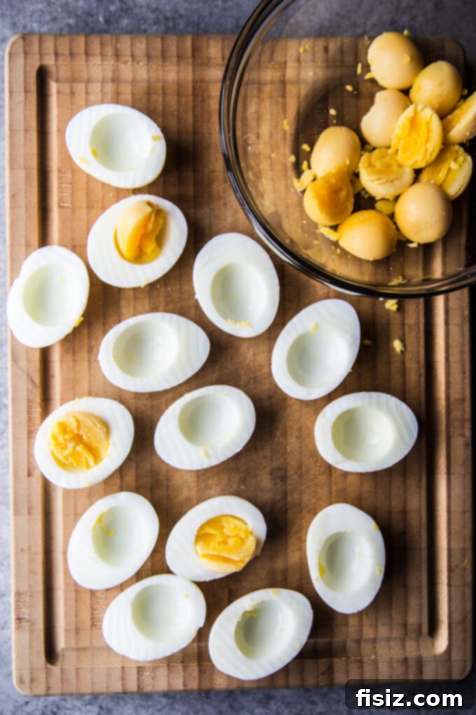 Deli-Style Chopped Cheese Deviled Eggs 6 Peeled hard-boiled eggs with yolks removed, ready for filling
