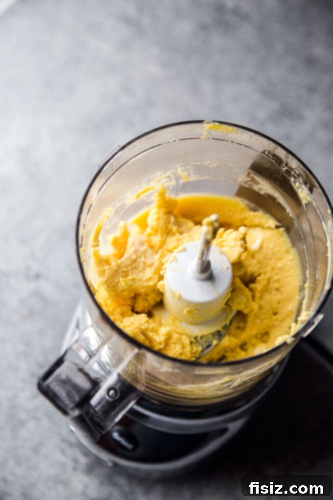 Deli-Style Chopped Cheese Deviled Eggs 7 Smooth and creamy deviled egg yolk puree in a food processor, ready for the chopped cheese mixture