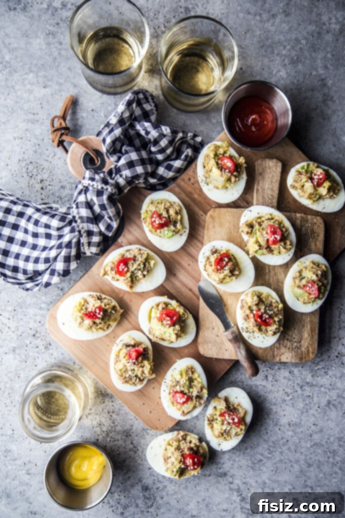 Deli-Style Chopped Cheese Deviled Eggs 9 Chopped Cheese Deviled Eggs on a clean, white platter, ready for guests