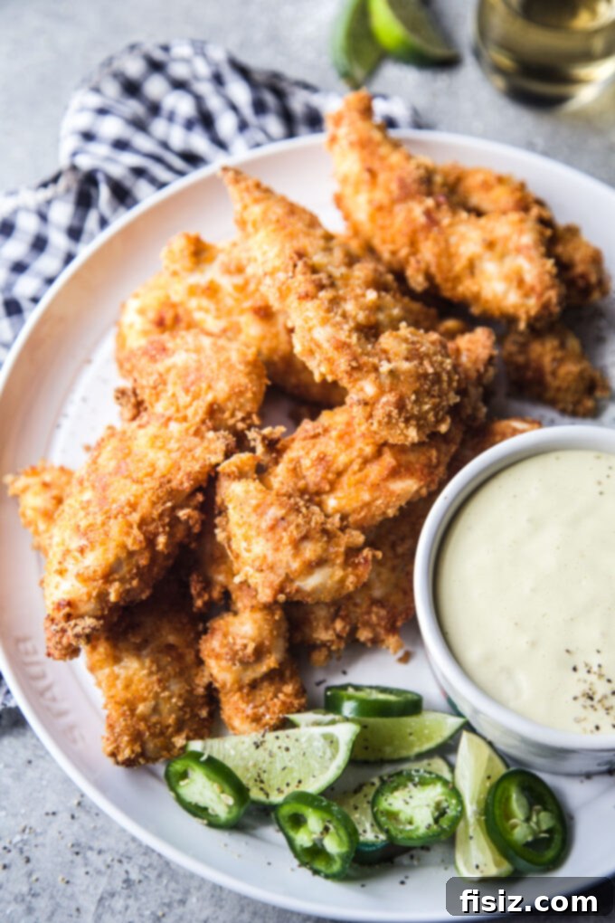 Air Fryer Chicharron Chicken Tenders with Green Chili Dipping Sauce, ready to be enjoyed