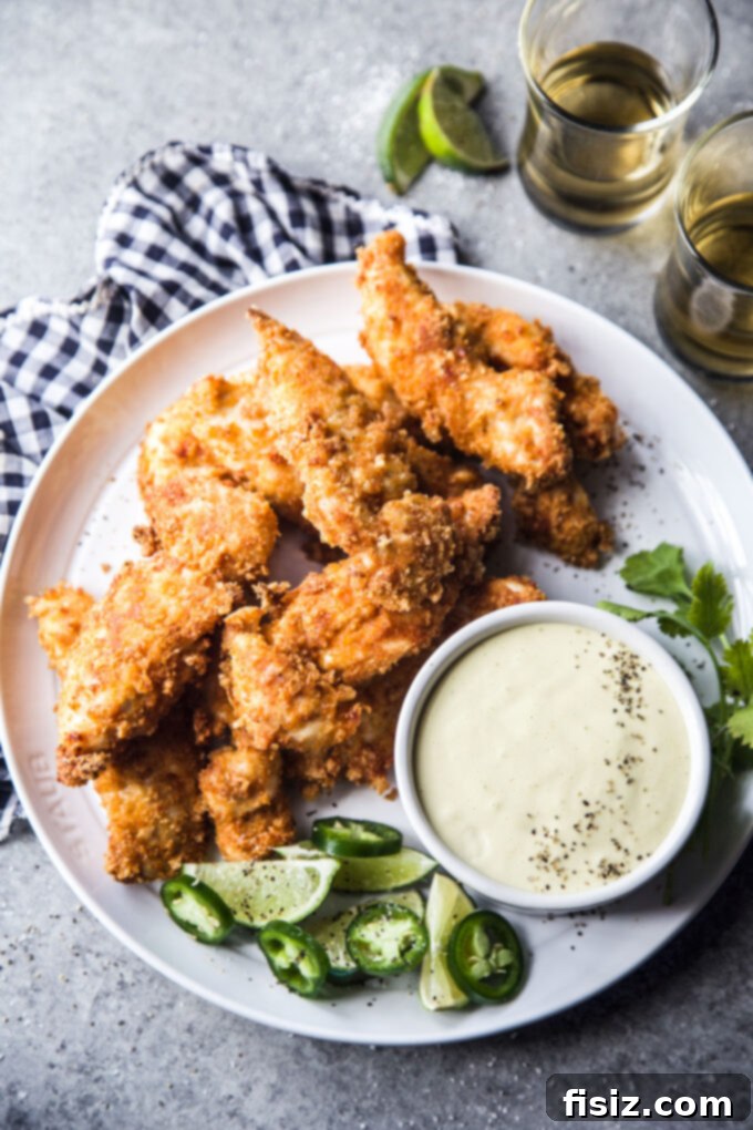 Air Fryer Chicharron Chicken Tenders with Green Chili Dipping Sauce, presented beautifully