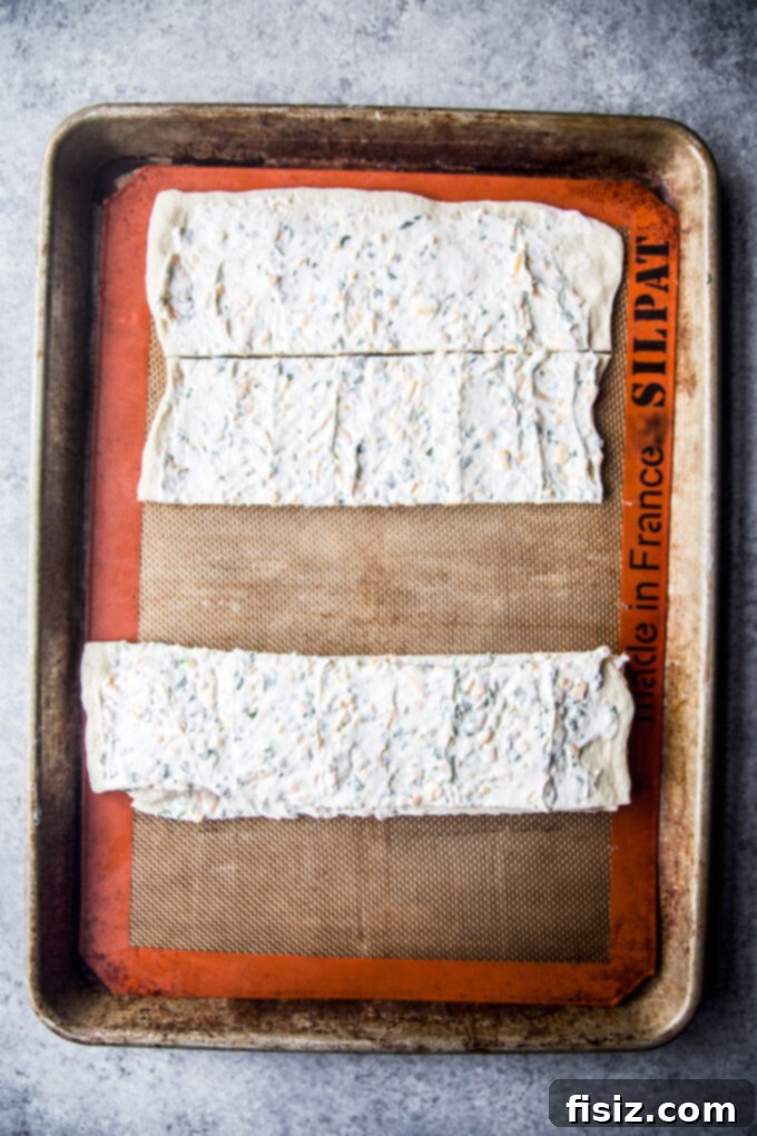 Bagel and Lox Pull-Apart Loaf with Cream Cheese 6 Prepared pizza dough sliced into stacked squares, ready for the loaf pan