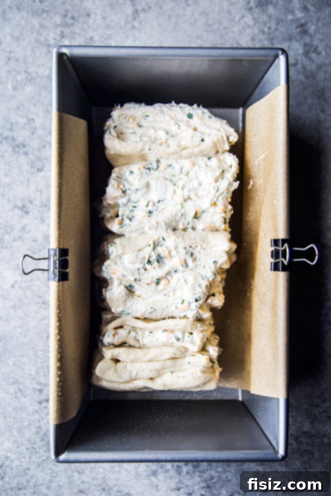 Bagel and Lox Pull-Apart Loaf with Cream Cheese 7 The assembled pull-apart loaf in the pan, ready for baking