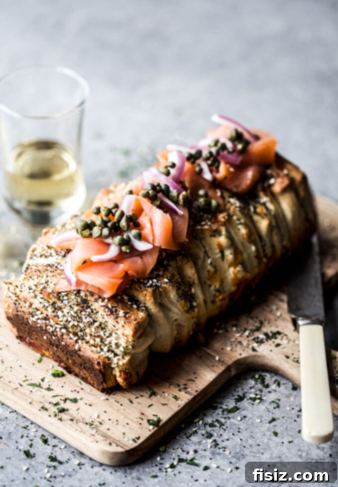 Bagel and Lox Pull-Apart Loaf with Cream Cheese 9 Overhead shot of the Cream Cheese Bagel & Lox Pull-Apart Loaf, freshly baked and garnished