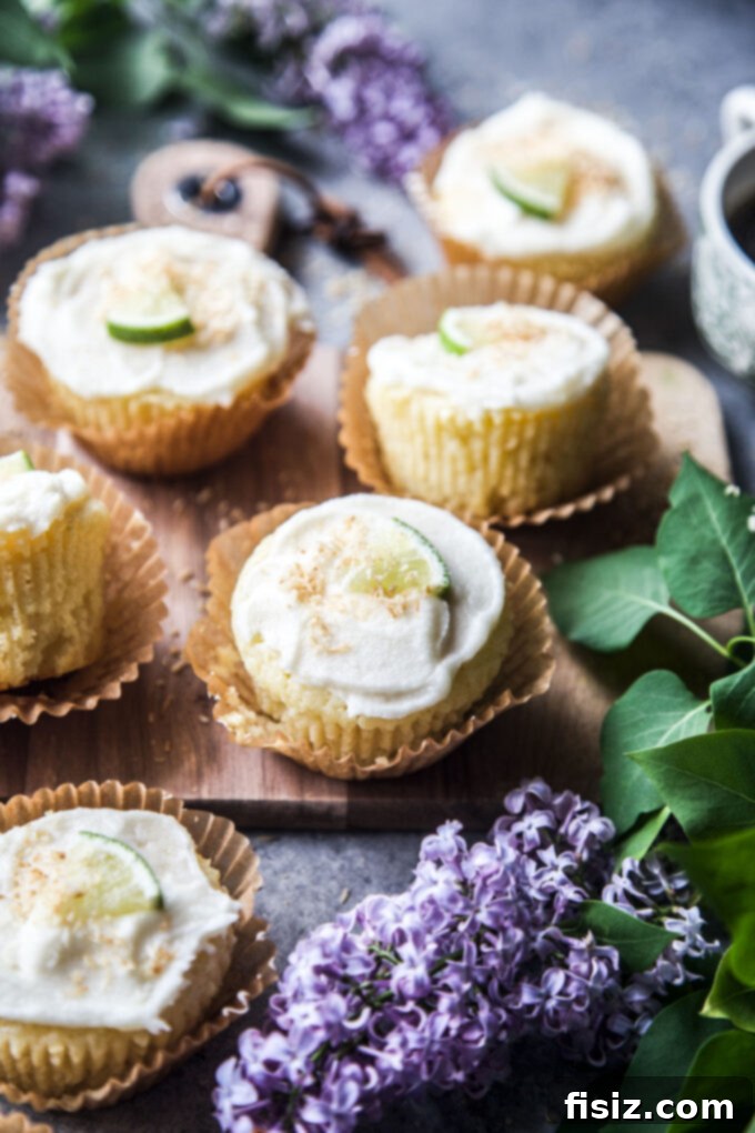 A display of Coconut Lime Ricotta Muffins with garnishes, ready to be served.