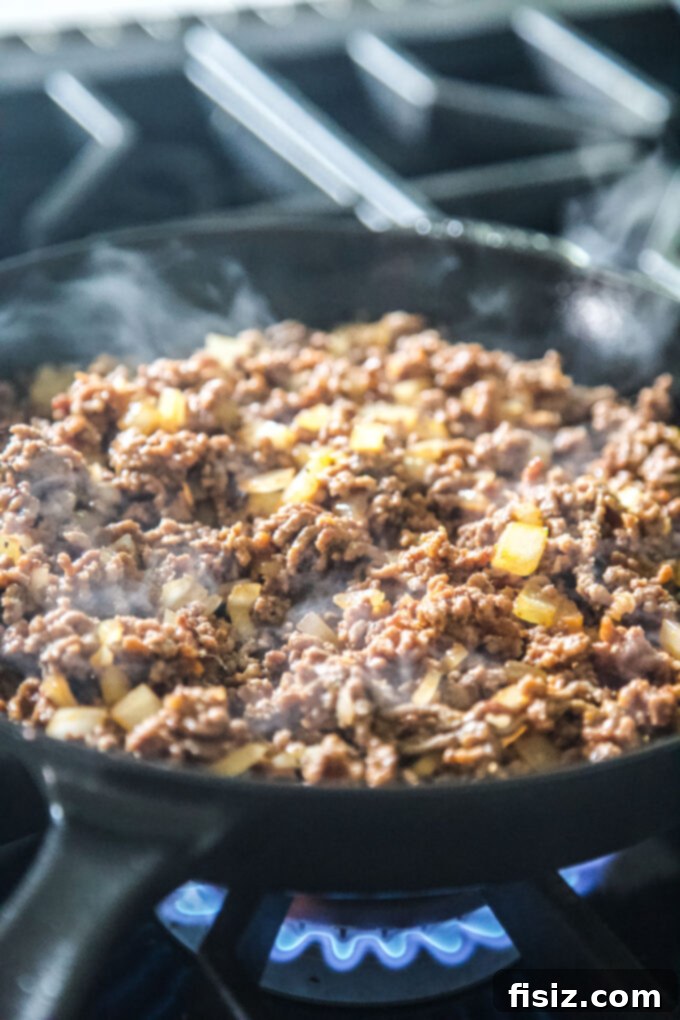 High-Protein Korean BBQ Cheeseburger Bake 5 korean bbq beef cooking in skillet