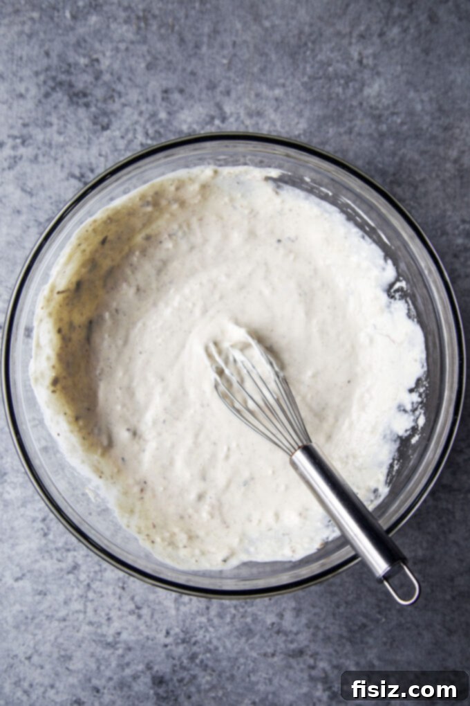 Effortless Asparagus Caesar 6 caesar dressing in a bowl