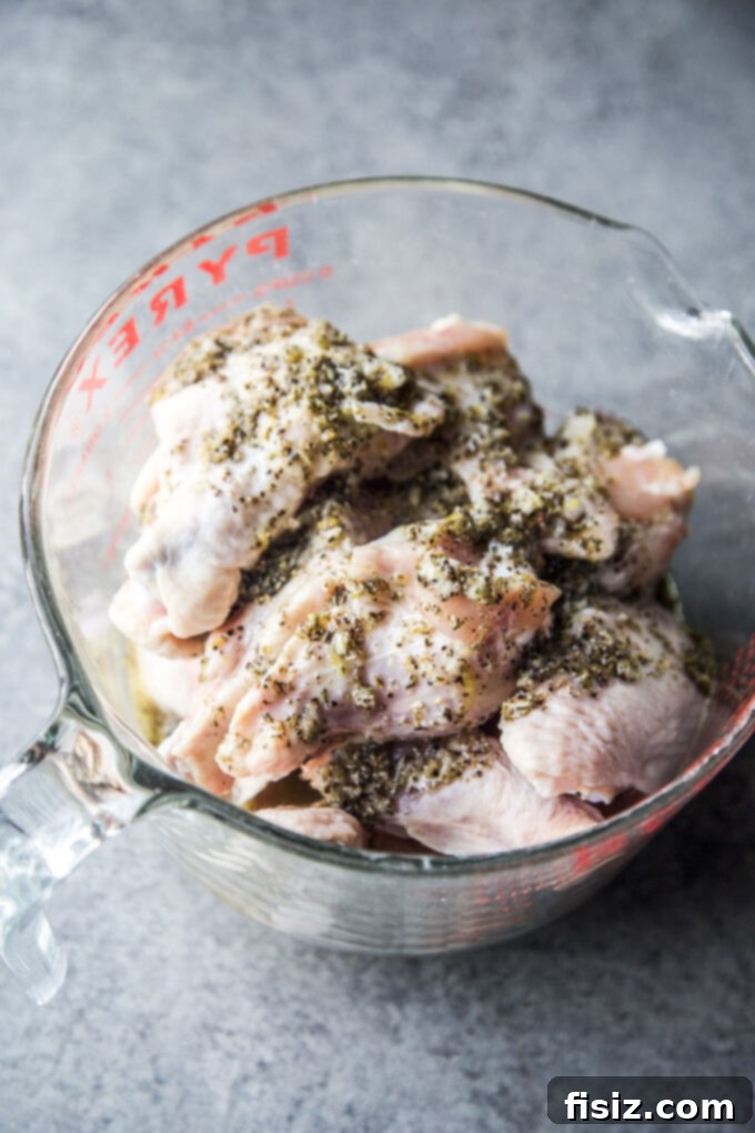 Zesty Spiced Greek Grilled Wings 5 greek dressing poured over wings
