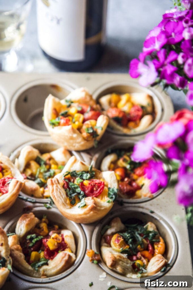 Savory Tomato Tarts 9 A serving of Muffin Pan Tajin Tomato Tarts, garnished with fresh basil.