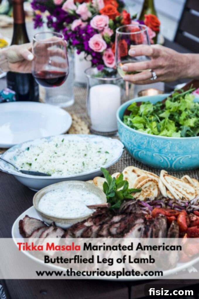 Tikka Masala Spiced American Butterflied Lamb 12 Beautifully presented sliced Tikka Masala Marinated American Butterflied Leg of Lamb, garnished with fresh herbs, ready for a meal.