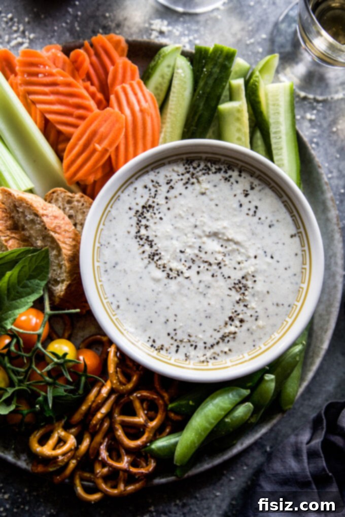 Cacio e Pepe Party Dip 3 Cacio e Pepe Dip served with crackers and vegetables