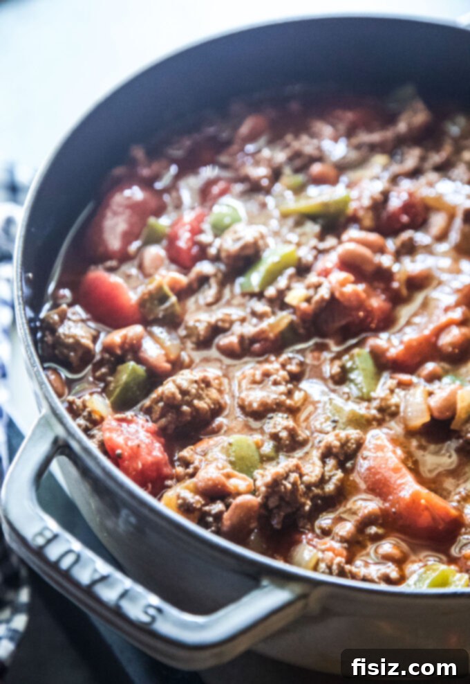 The Ultimate Classic Ground Beef Chili 6 ground beef, peppers, tomatoes and spices in a pot