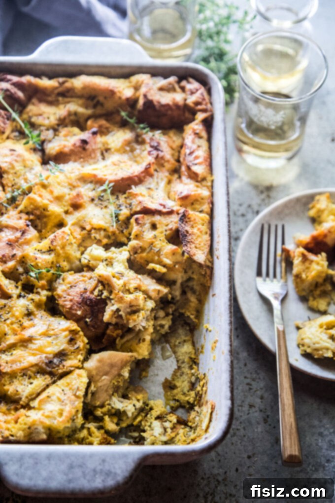 Golden Pumpkin and Smoky Cheddar Strata 8 A slice of Pumpkin and Smoked Cheddar Strata, showing distinct layers