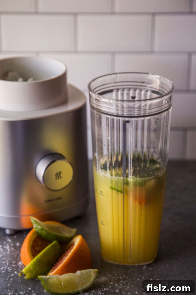 Beat the Bloat: 3 DIY Tonics for Thanksgiving Digestion 4 Ingredients for the Spiced Sunshine Tonic, featuring fresh orange juice, lime juice, turmeric, ginger, jalapeno, and garlic.